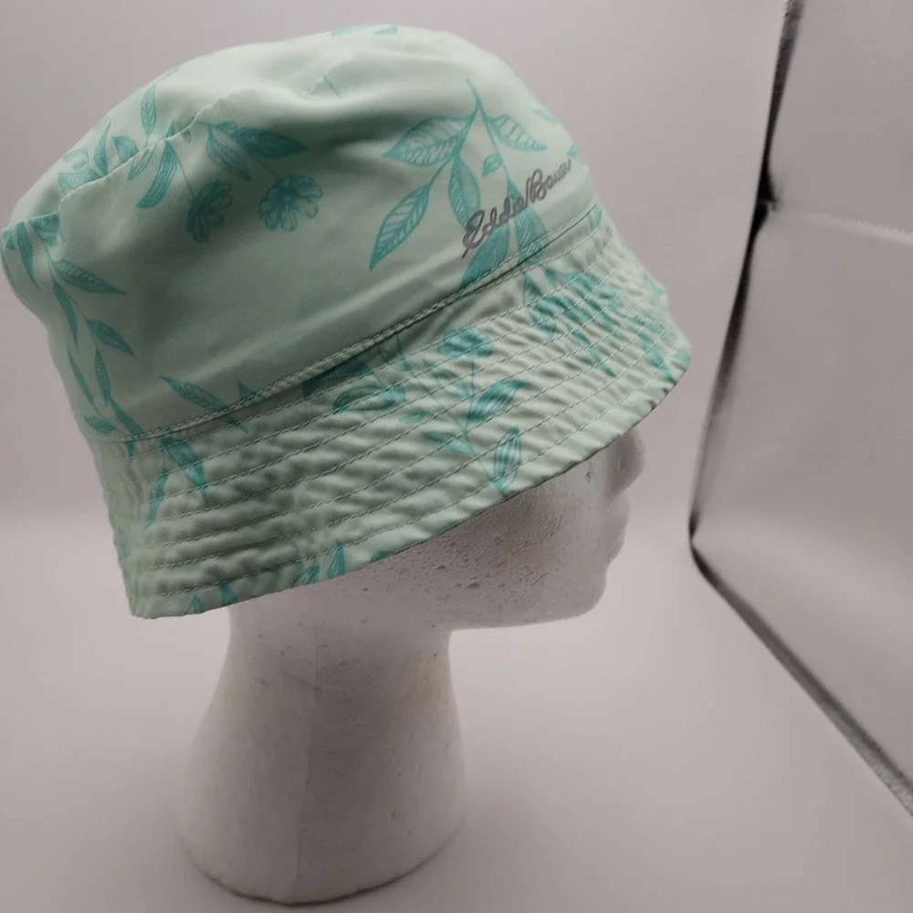 Women's Eddie Bauer floral bucket hat in mint green with aqua blue leaf floral